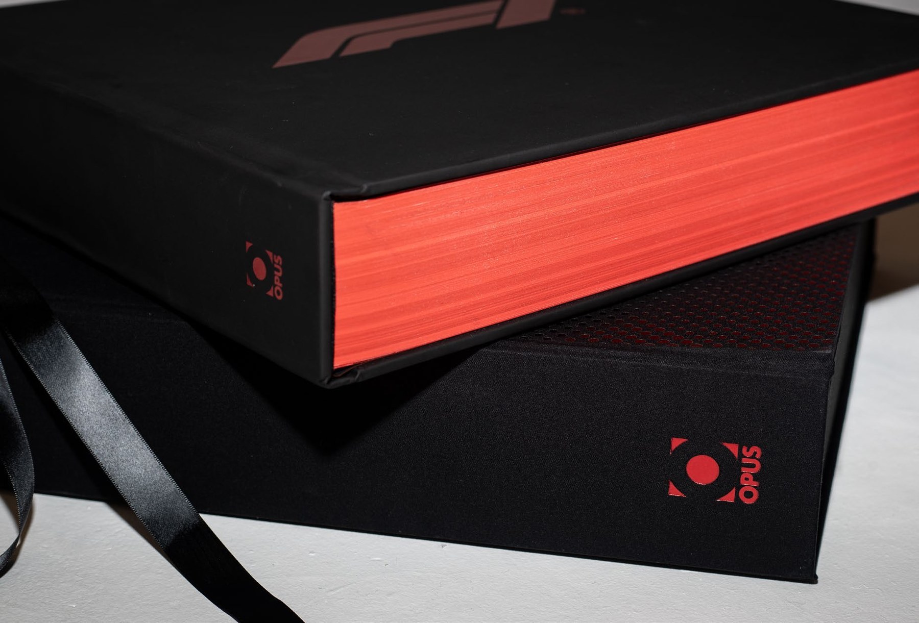 The Official F1 75 Opus red-foiled spine detail